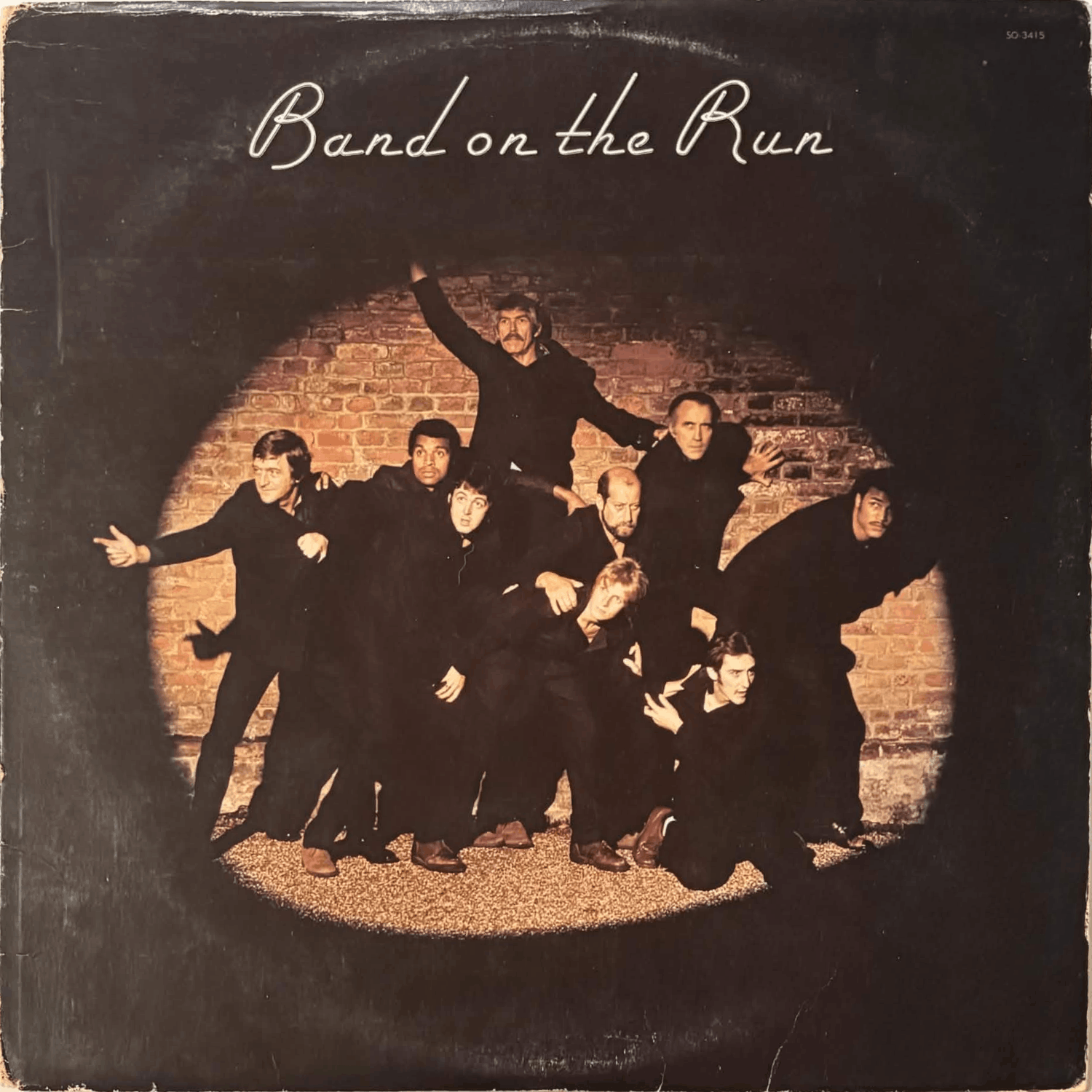 Album cover has noticeable ring wear.